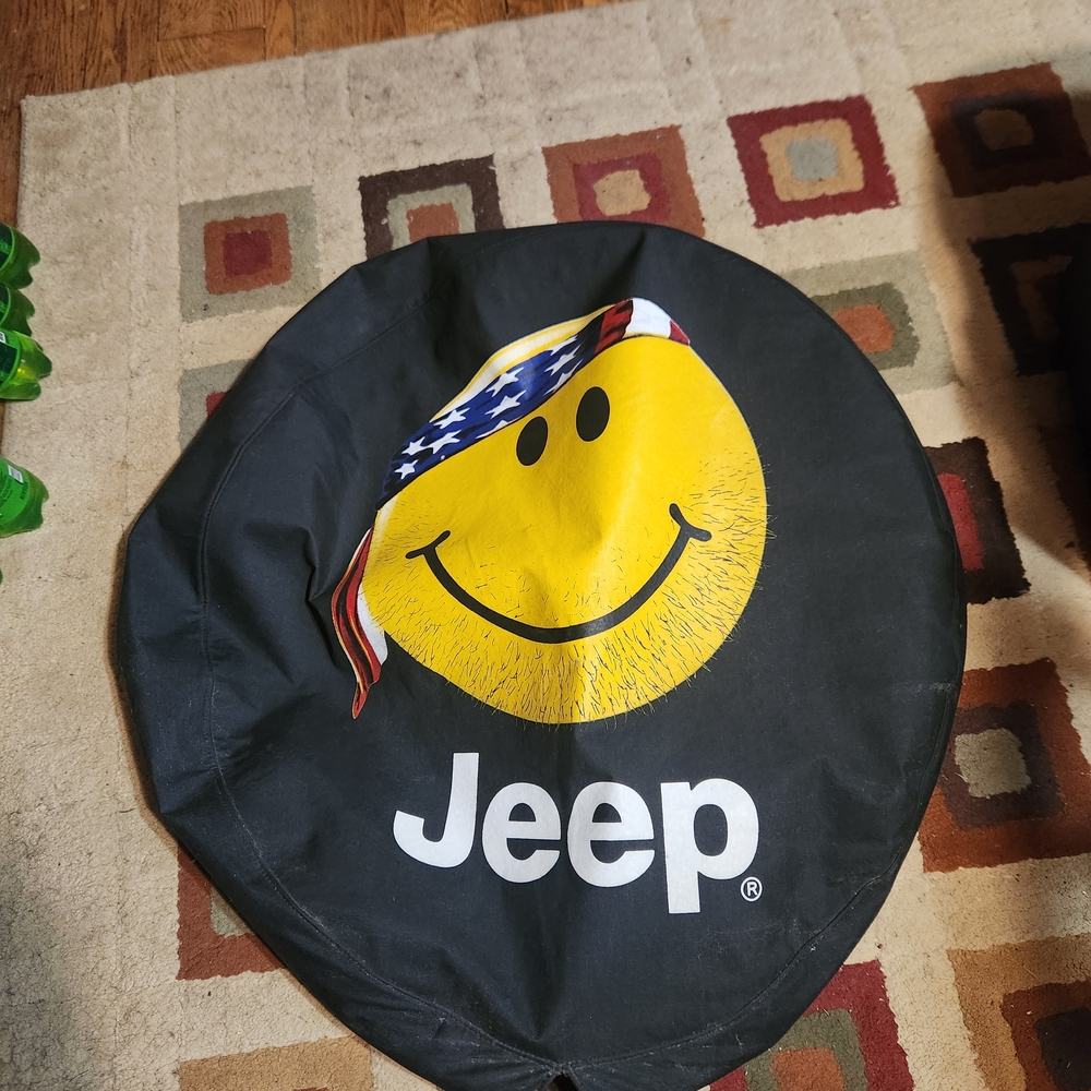 Jeep Tire Cover with Yellow Smiley and Flag Bandana